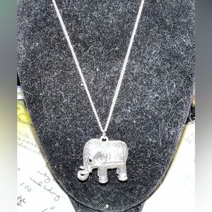 Silver tone detailed elephant pendant on a 28” chain. Pendant is 1” long.